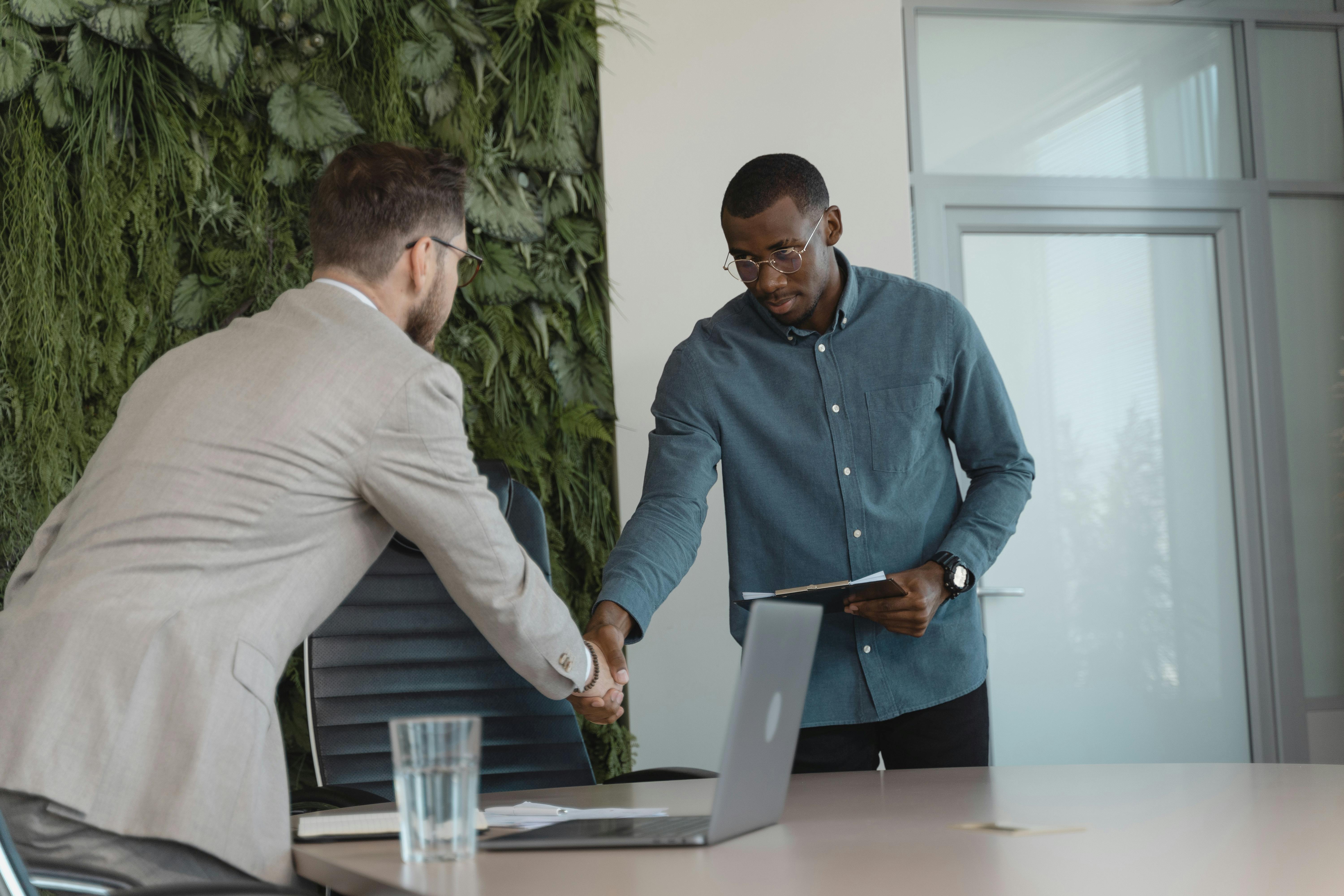 A man stands in front of a wall filled with creative ideas and plans. Ideal for innovation themes.